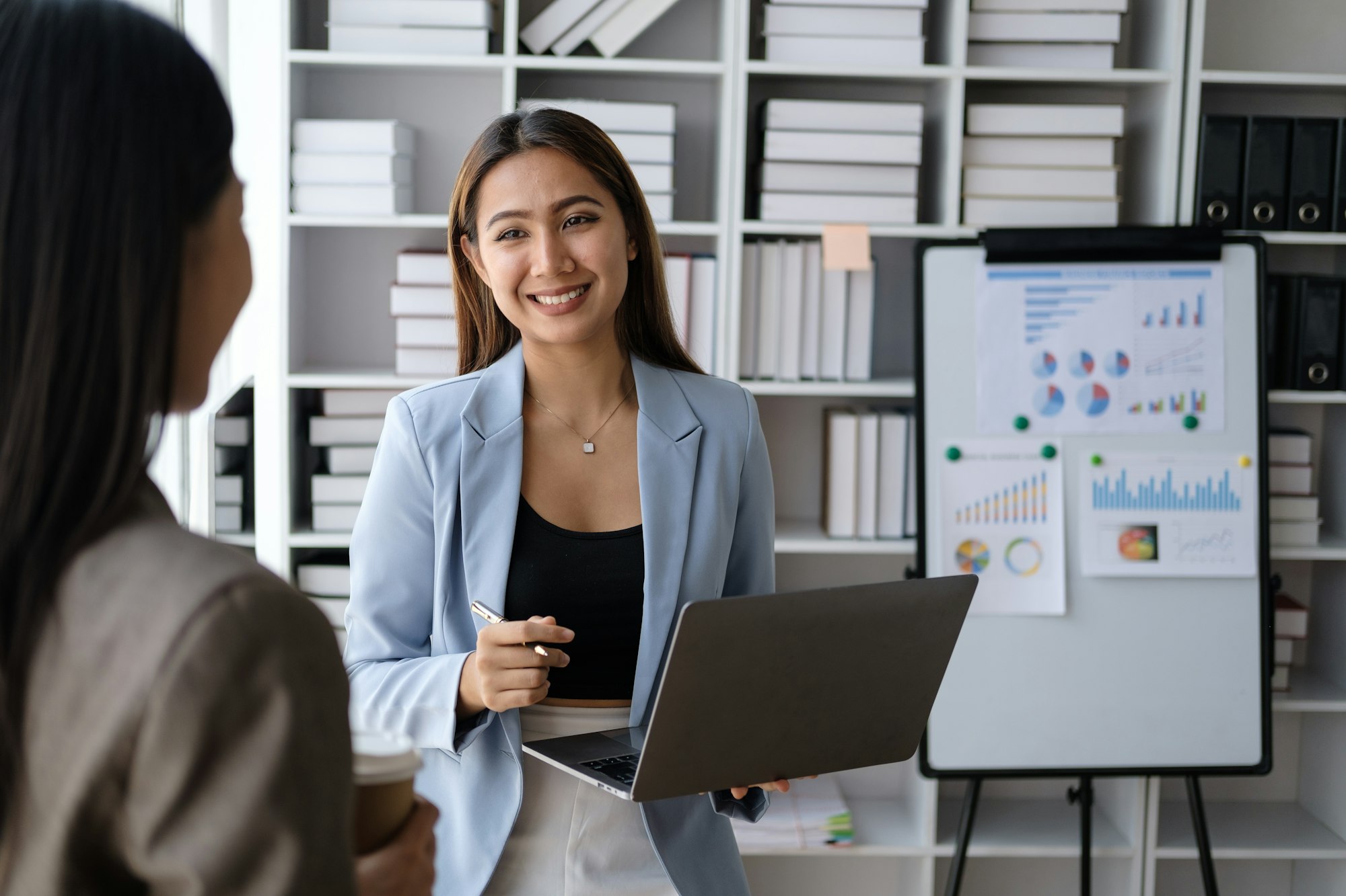 Young smart team of businesspeople working together with laptop to find the best solutions.